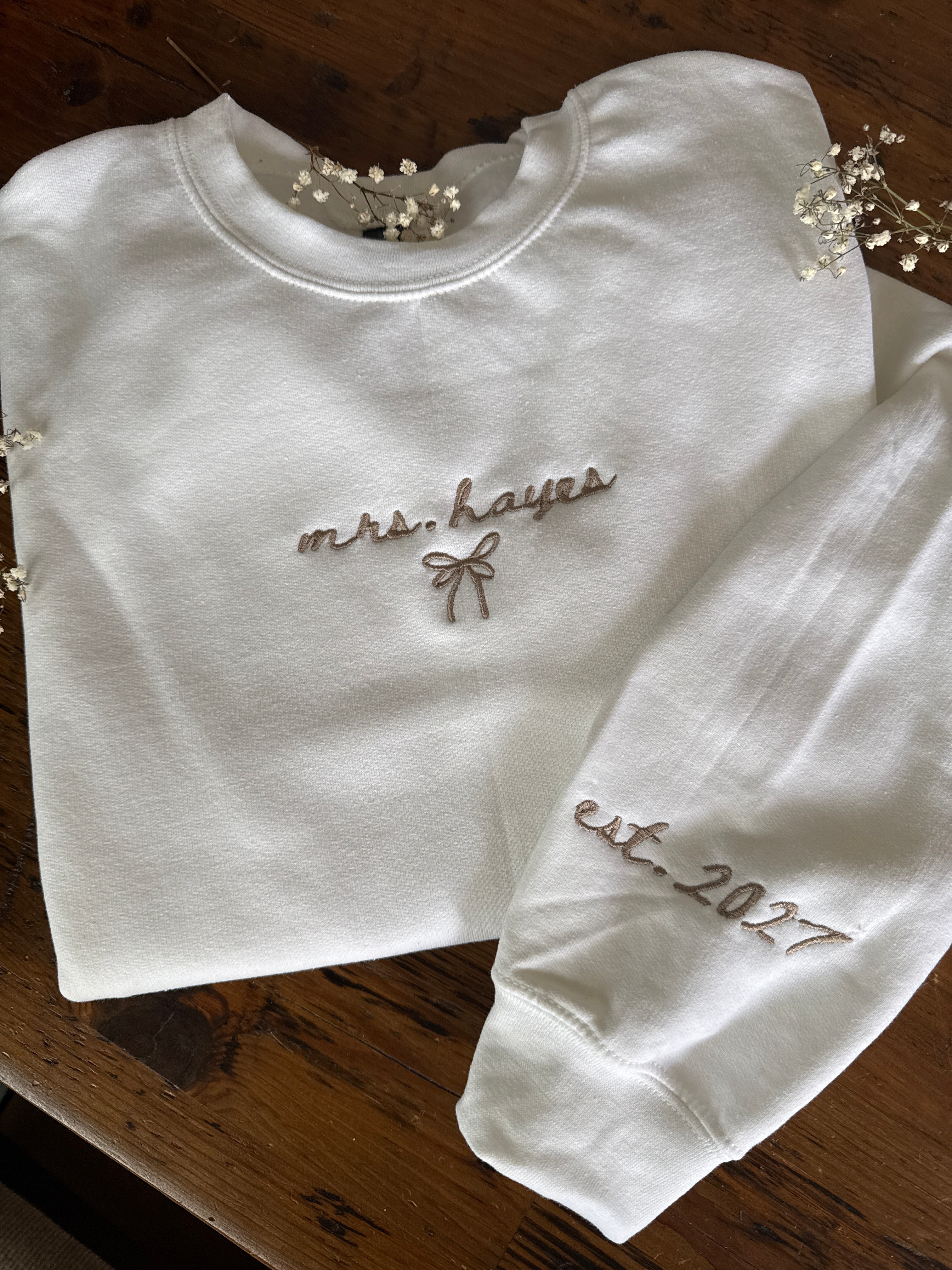 Custom embroidered Mrs. crewneck with wedding year on sleeve
